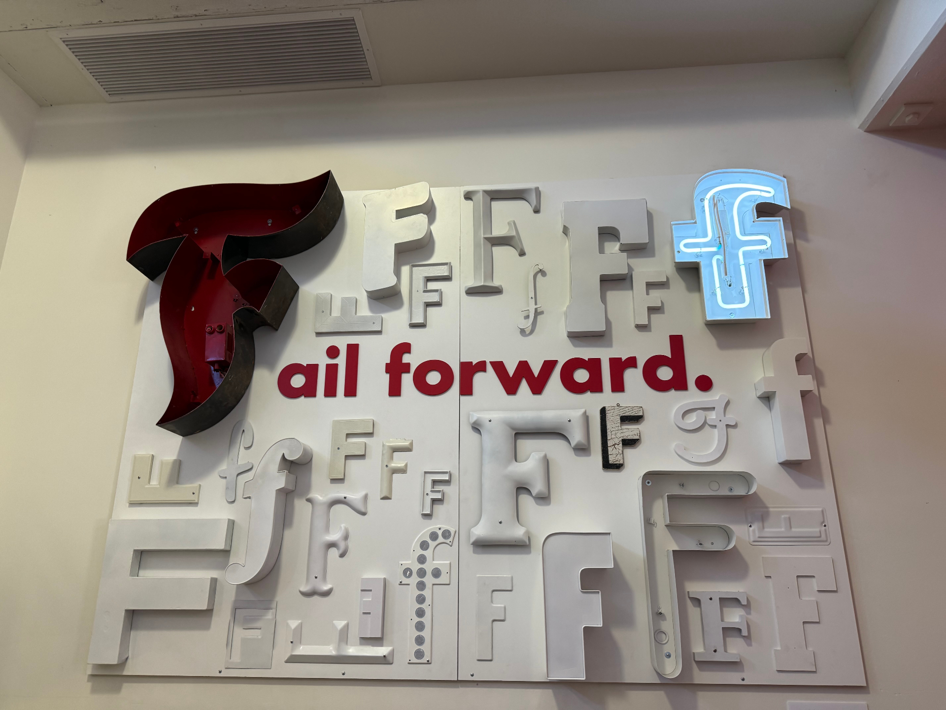 Wall installation reading fail forward at a startup ecosystem venue
