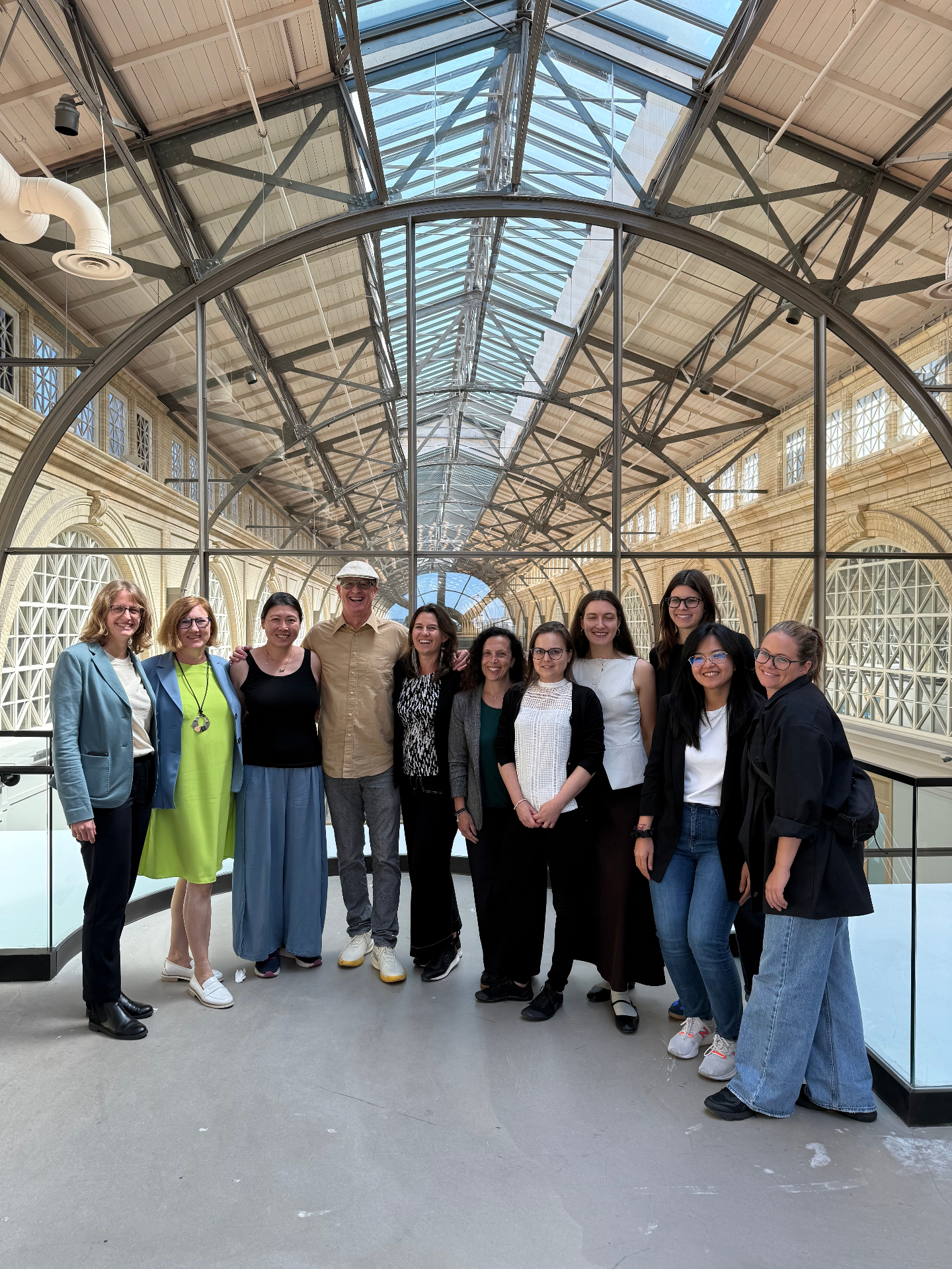 Group portrait from a GUILD innovation program inside a large civic venue